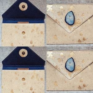 Acid washed 8 x 10 hide clutch.
